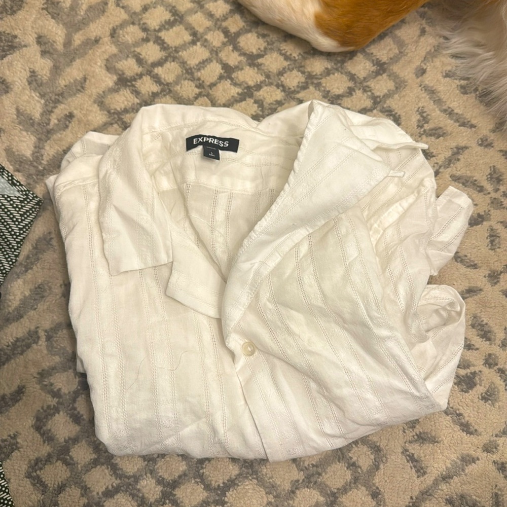 Men’s white linen, short sleeve vacation style shirt.